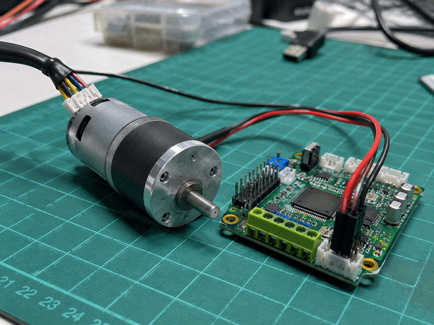Electronics assembly on green cutting mat