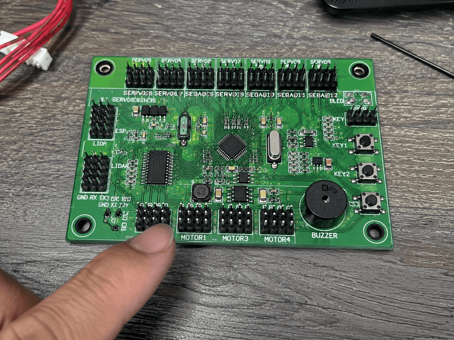 Electronics workbench with circuit board close-up
