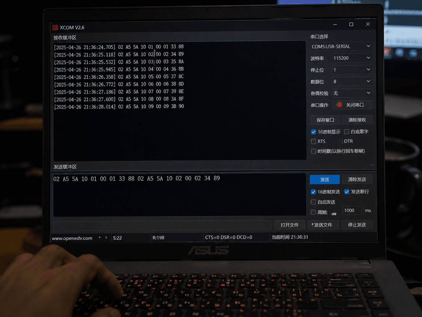 Laptop and terminal in dim workspace