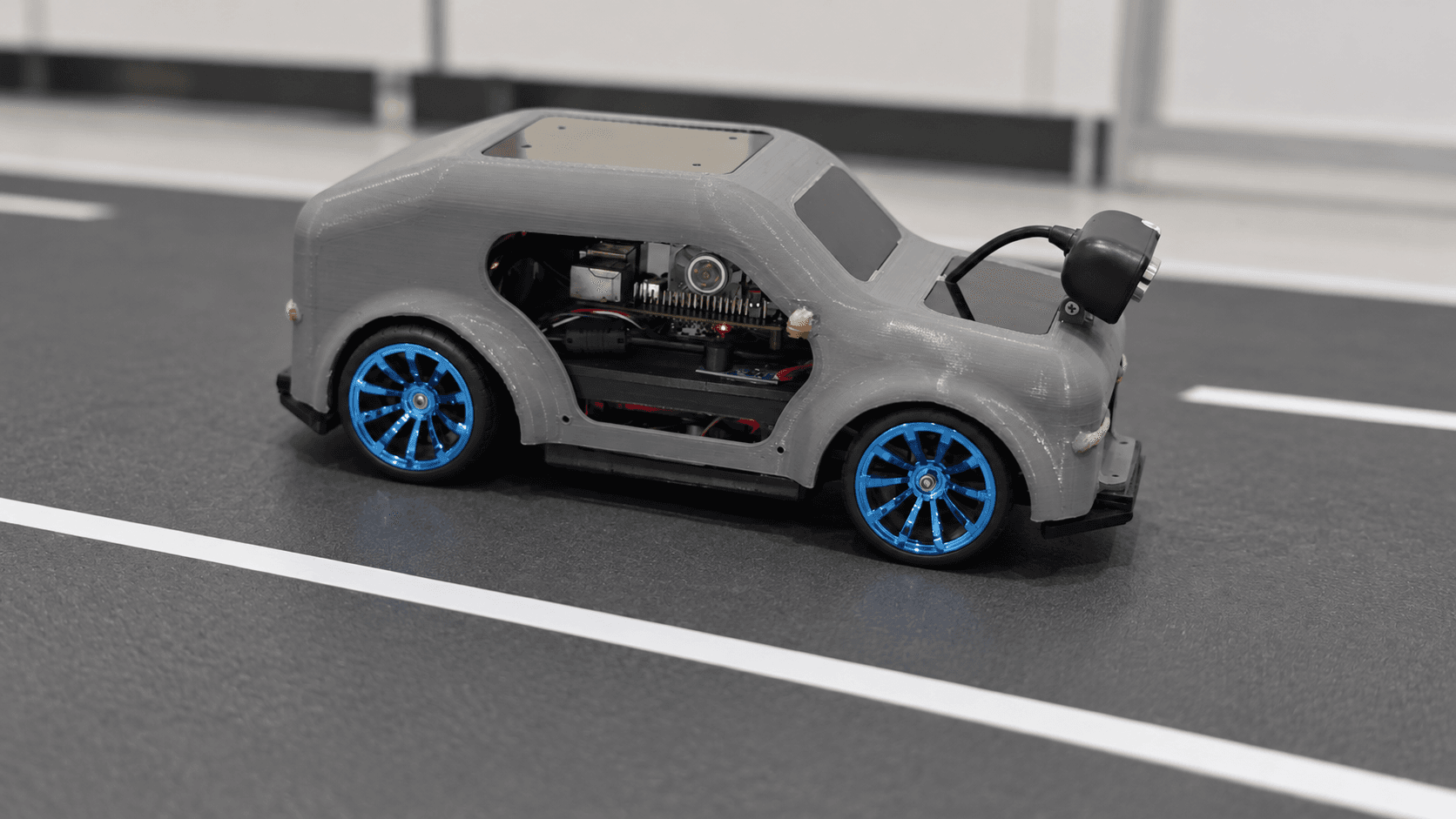 BlinkThor Robot vehicle cover — digitally restyled from an actual prototype frame. Background recreated for presentation; not recorded test evidence.